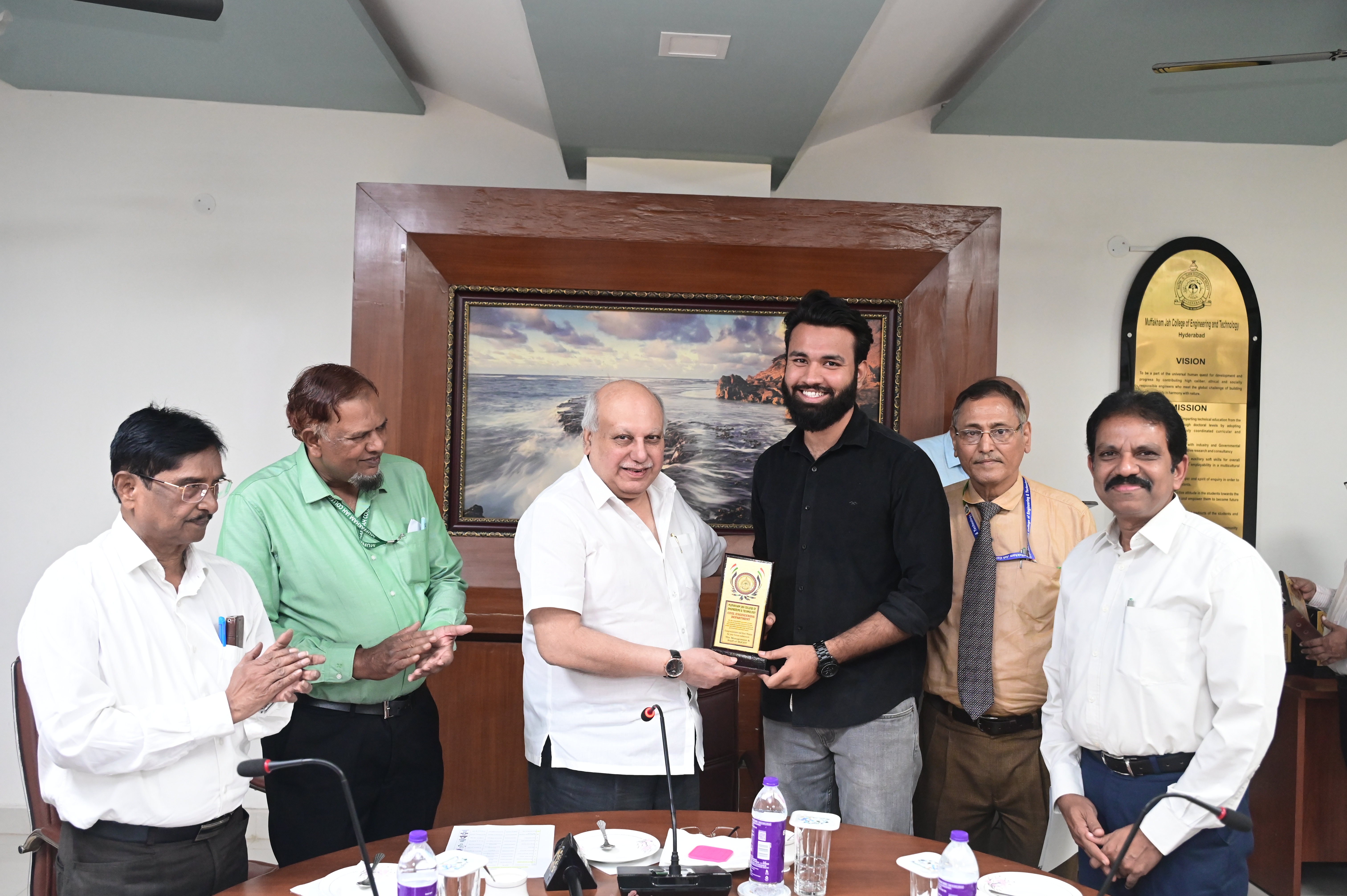 Mr. Syed Mujtaba Ali, AE receiving memento from Hon. Secretary Janab Zafar Javeed, SUES